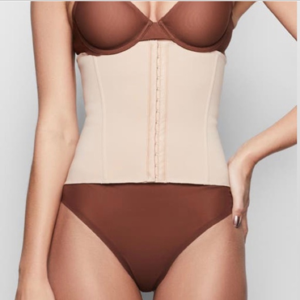 Skims waist trainer. NWT in original packaging. Never opened. Color: clay